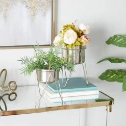 CosmoLiving by Cosmopolitan 7 in. x 10 in. Silver Metal Modern Planter(Set of 2) 13 CosmoLiving by Cosmopolitan 7 in. x 10 in. Silver Metal Modern Planter(Set of 2) -Everbilt Sales Store silver cosmoliving by cosmopolitan plant pots 040159 31 1000